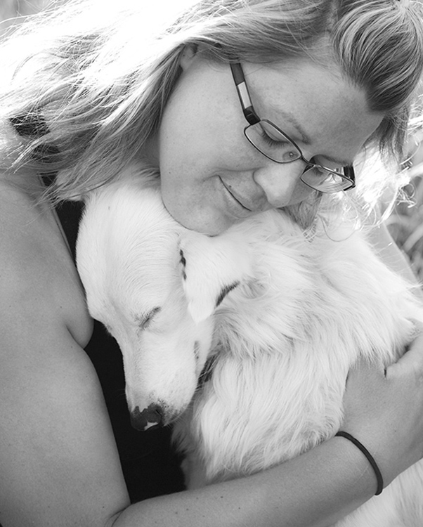 Woman hugging dog